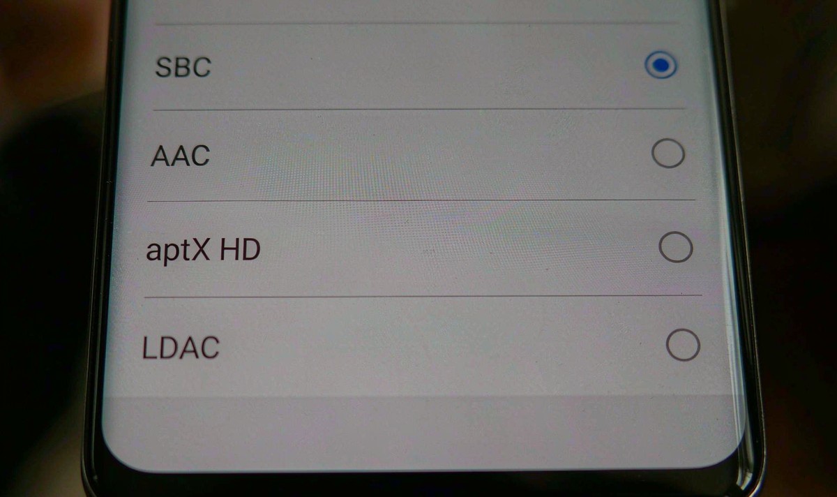 Smartphone screen showing a Bluetooth audio codec list with SBC selected and AAC, aptX HD and LDAC listed underneath