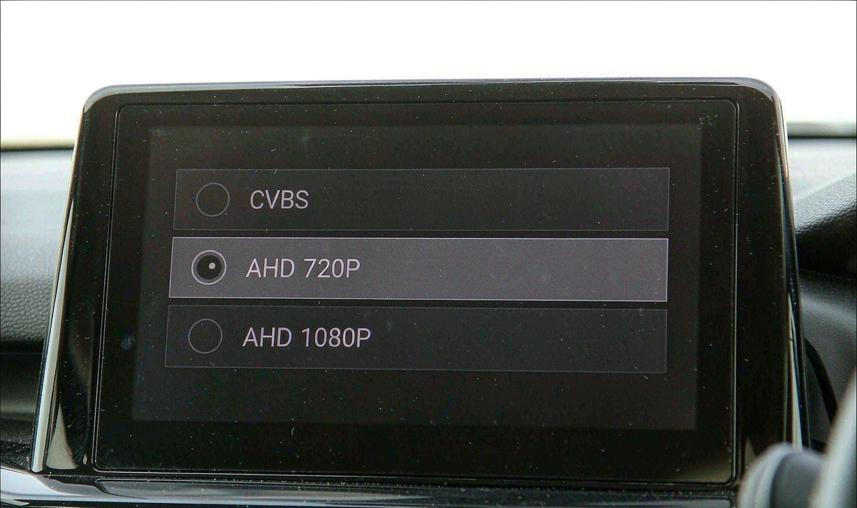 Head unit camera settings screen showing a video signal row with CVBS and AHD 720P and AHD 1080P options