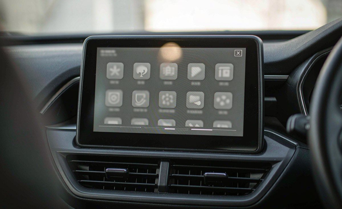 App launcher grid on a car head unit android screen with several background updates running